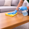 Cleaner sprucing up a wooden table