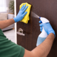 Wiping down a wooden door